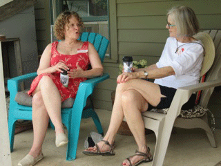 women talking on porch